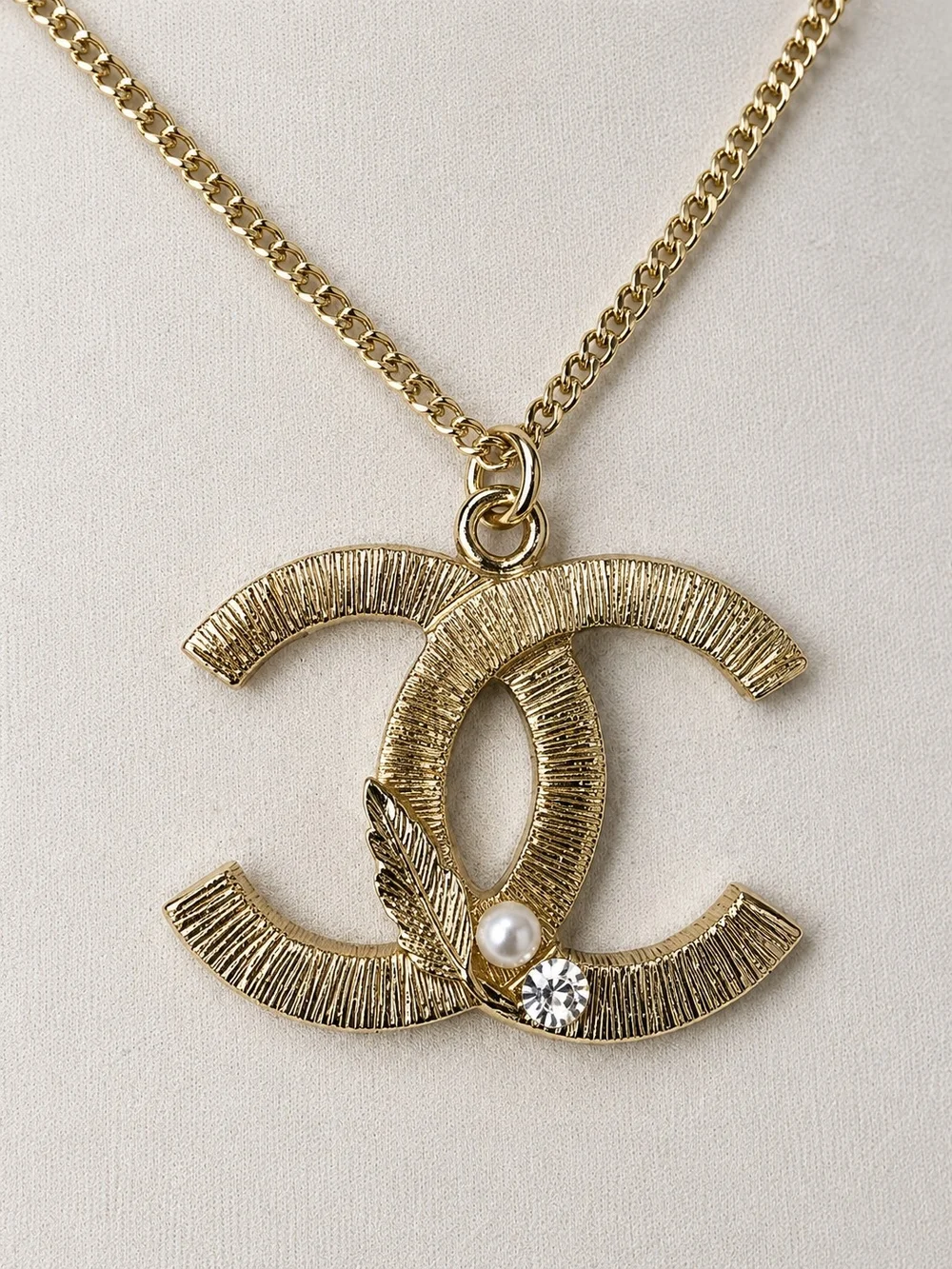 CHANEL Gold-Tone Textured Interlocking CC Pendant Necklace